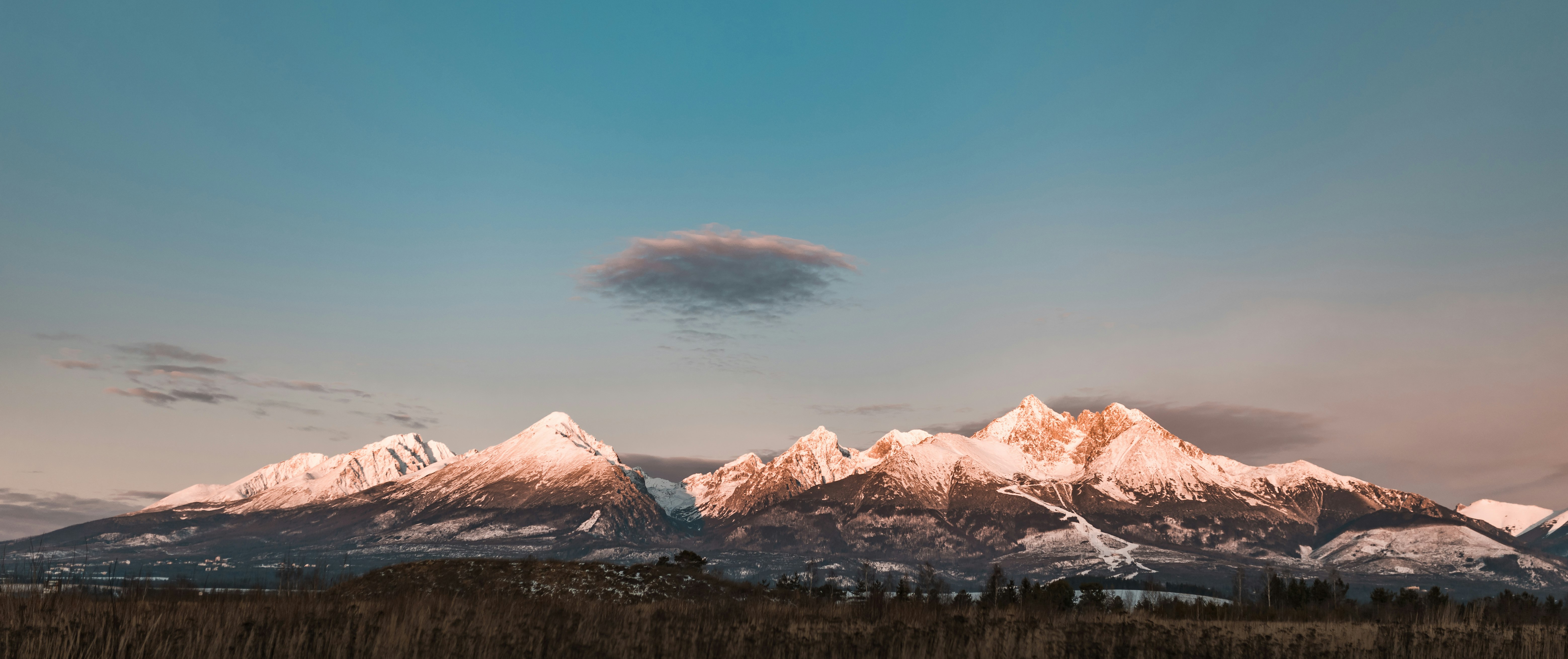 summit view of mountain under blue and white sky